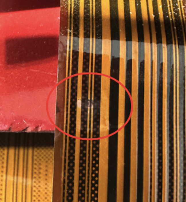 Abrasion visible on flex harness traces